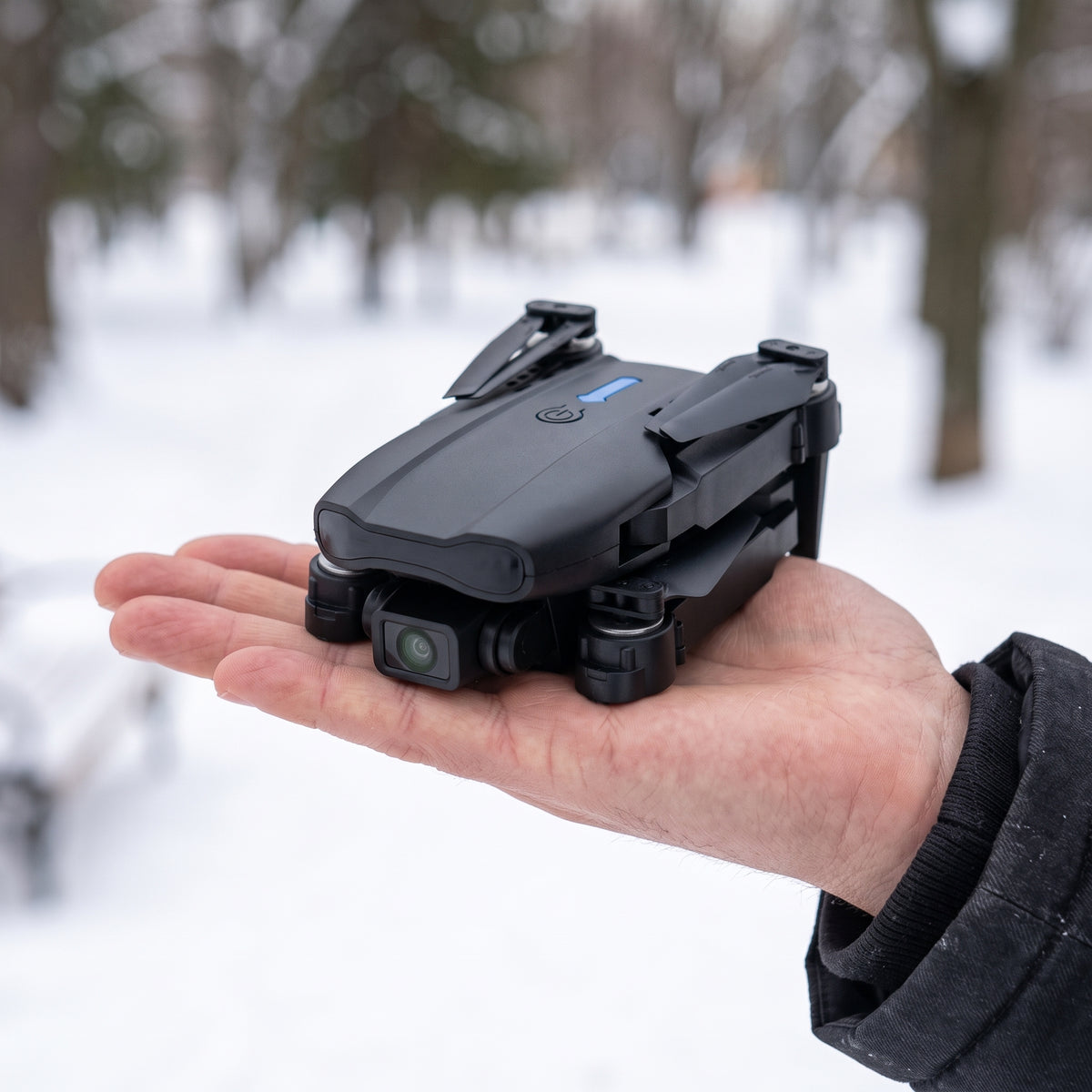Black Skyline drone folded in the palm of a hand